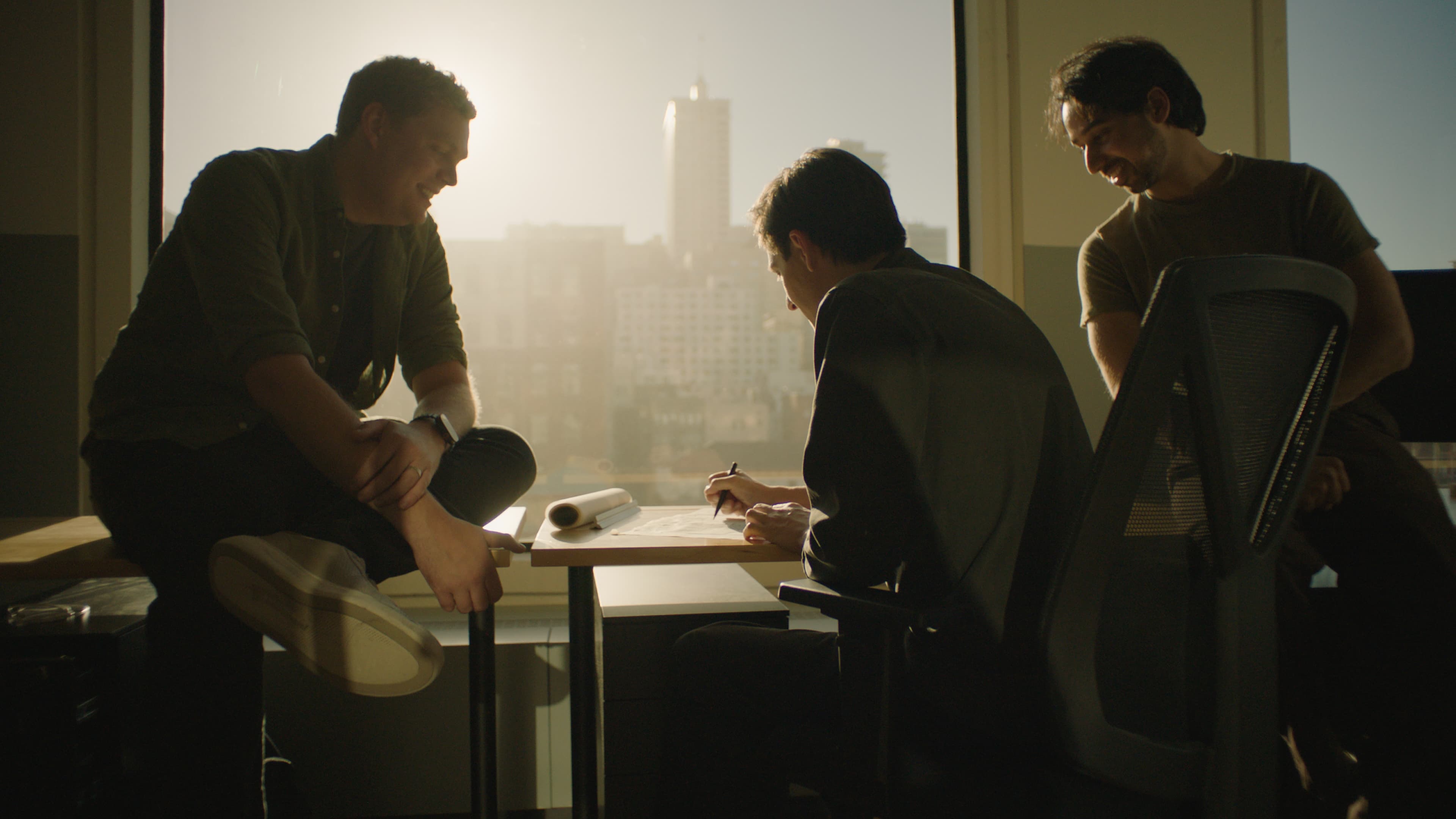 The Dream team collaborating around an architectural model